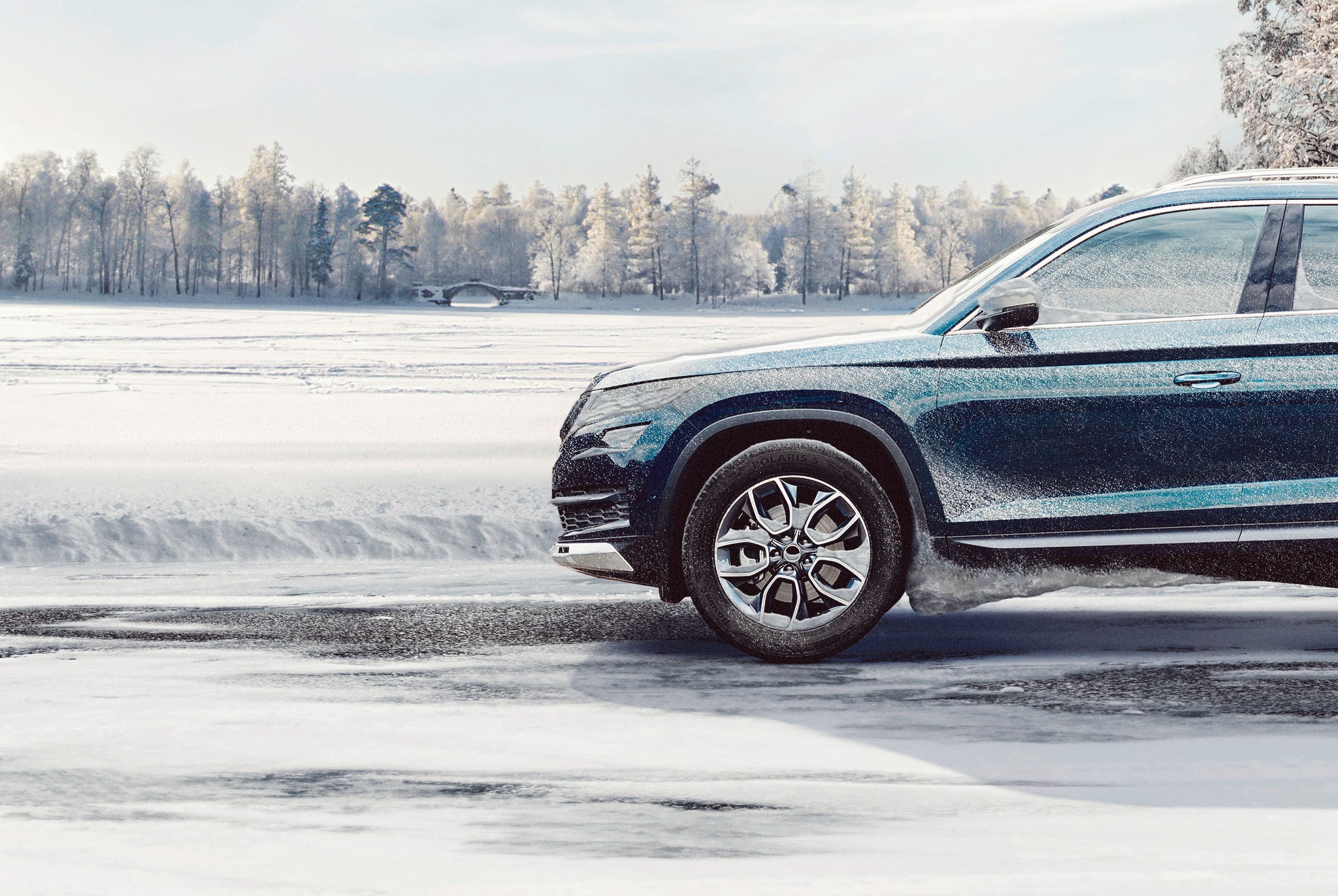 Barum Polaris 5 winter tyre on a blue SUV in the snow